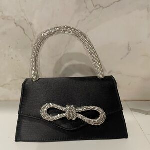 Mini black bag with diamanté handle and bow